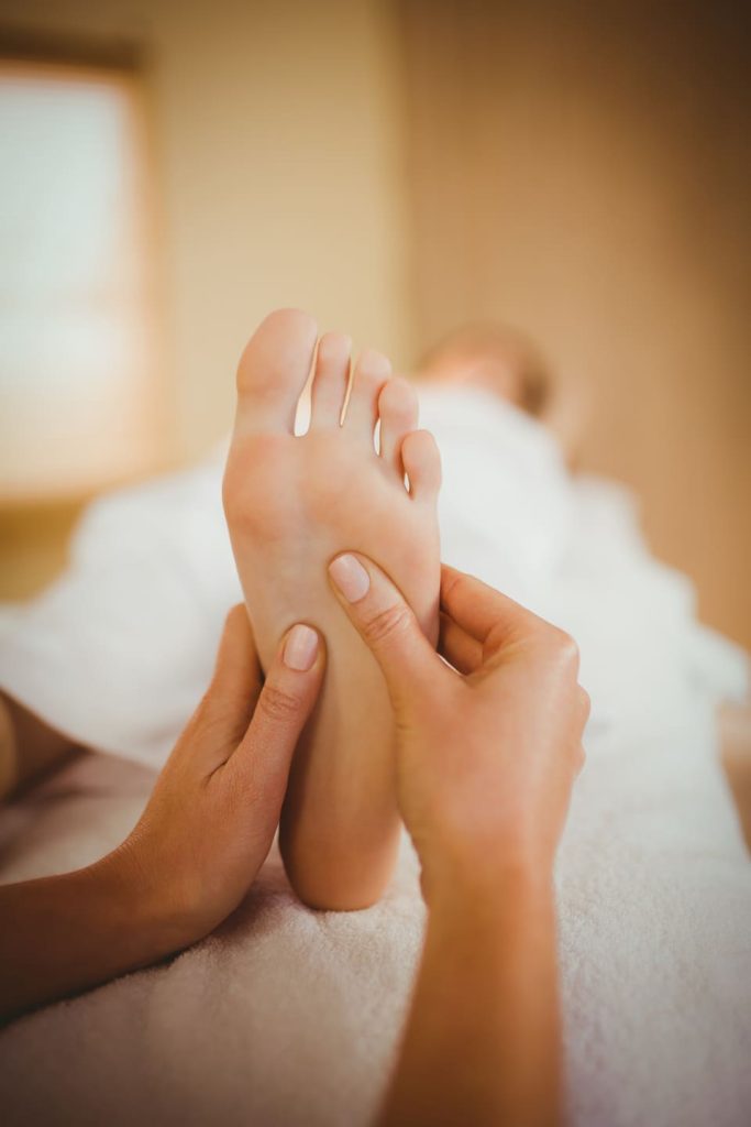 young-woman-getting-foot-massage-in-therapy-room-2025-04-05-00-24-09-utc