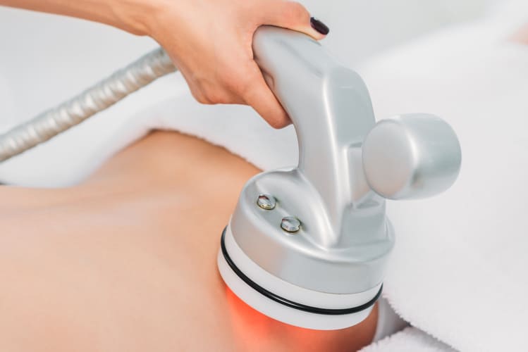 cropped-shot-of-woman-on-massage-table-getting-ele-2024-11-15-12-26-27-utc (1)