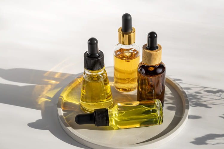 glass-dropper-bottles-with-beauty-oils-or-serum-on-2024-12-06-09-29-59-utc