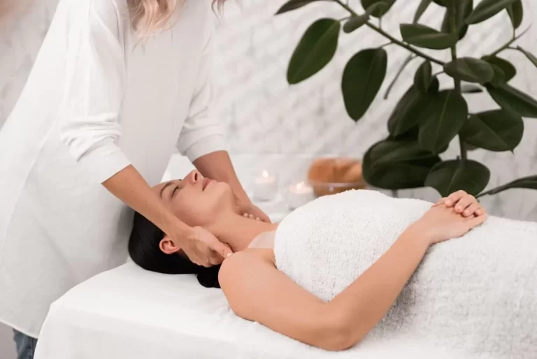 masseuse-massaging-neck-of-client-2025-03-13-14-54-49-utc-e1749562921897