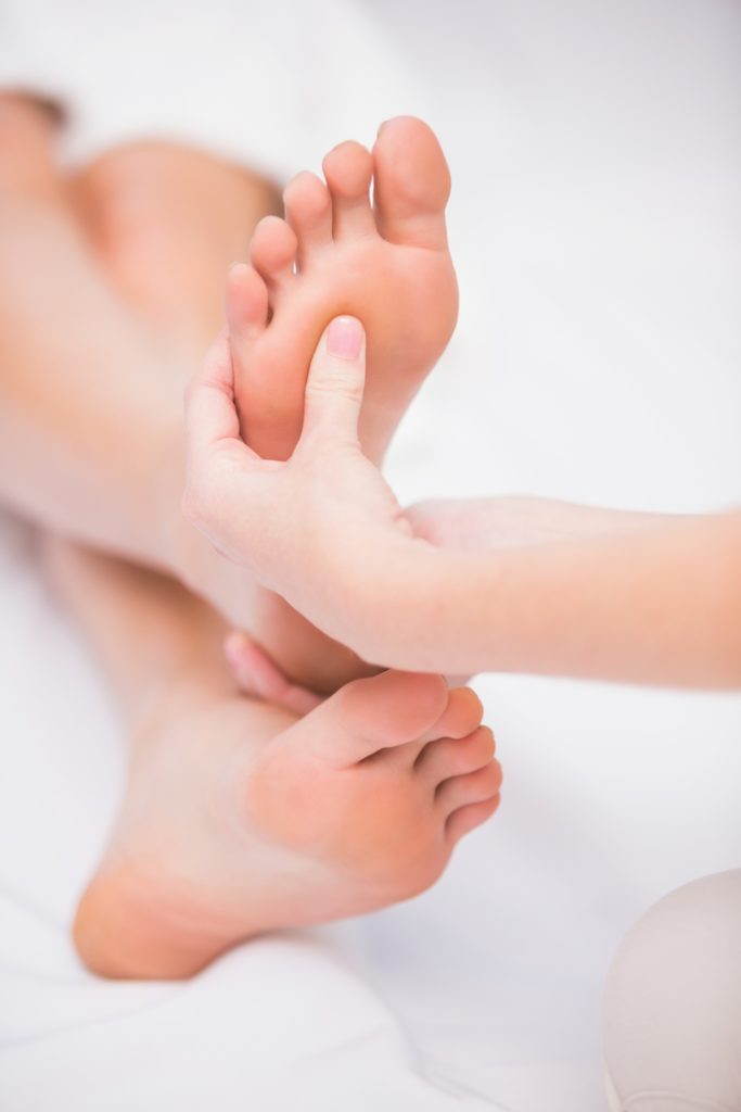 Woman receiving a foot massage at the beauty salon
